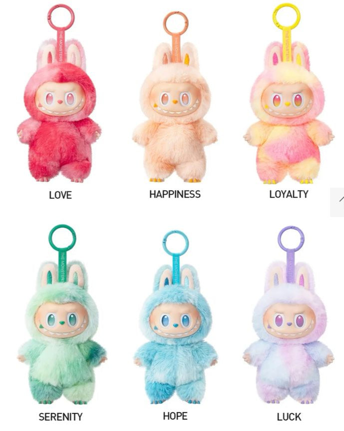 Set of Labubu plush keychains from the "Big Into Energy" series, featuring six colorful characters each representing a different emotion or value—Love (red), Happiness (peach), Loyalty (yellow-pink), Serenity (green), Hope (blue), and Luck (purple)—all dressed in fuzzy bunny suits with matching keyring tags.