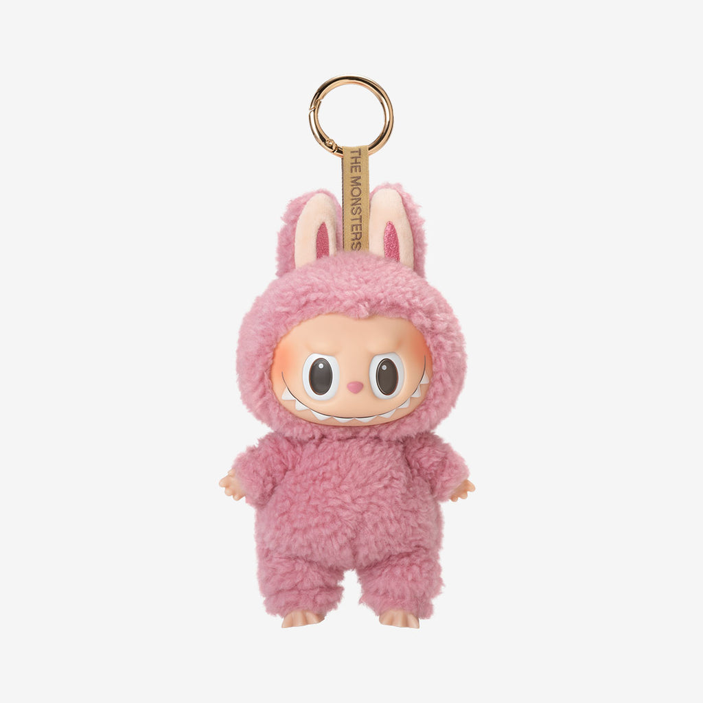 Labubu Lychee Berry keychain plush from the "Exciting Macarons" series, featuring a dark brown fuzzy bunny costume with upright ears and a wide, toothy grin