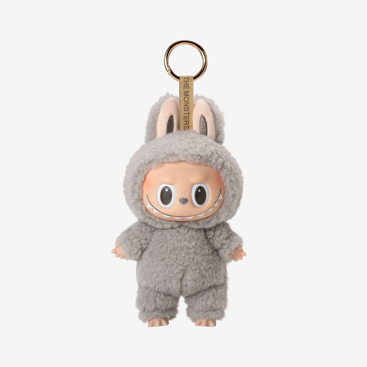 Labubu Sesame Bean keychain plush from the "Exciting Macarons" series, featuring a dark brown fuzzy bunny costume with upright ears and a wide, toothy grin