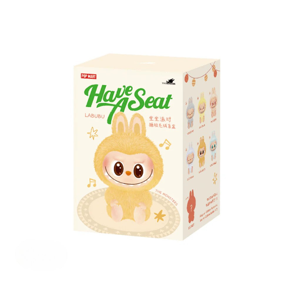 Packaging box of Pop Mart Labubu “Have A Seat” series featuring a yellow fuzzy Labubu character with bunny ears on the front and a lineup of collectible designs illustrated on the side.